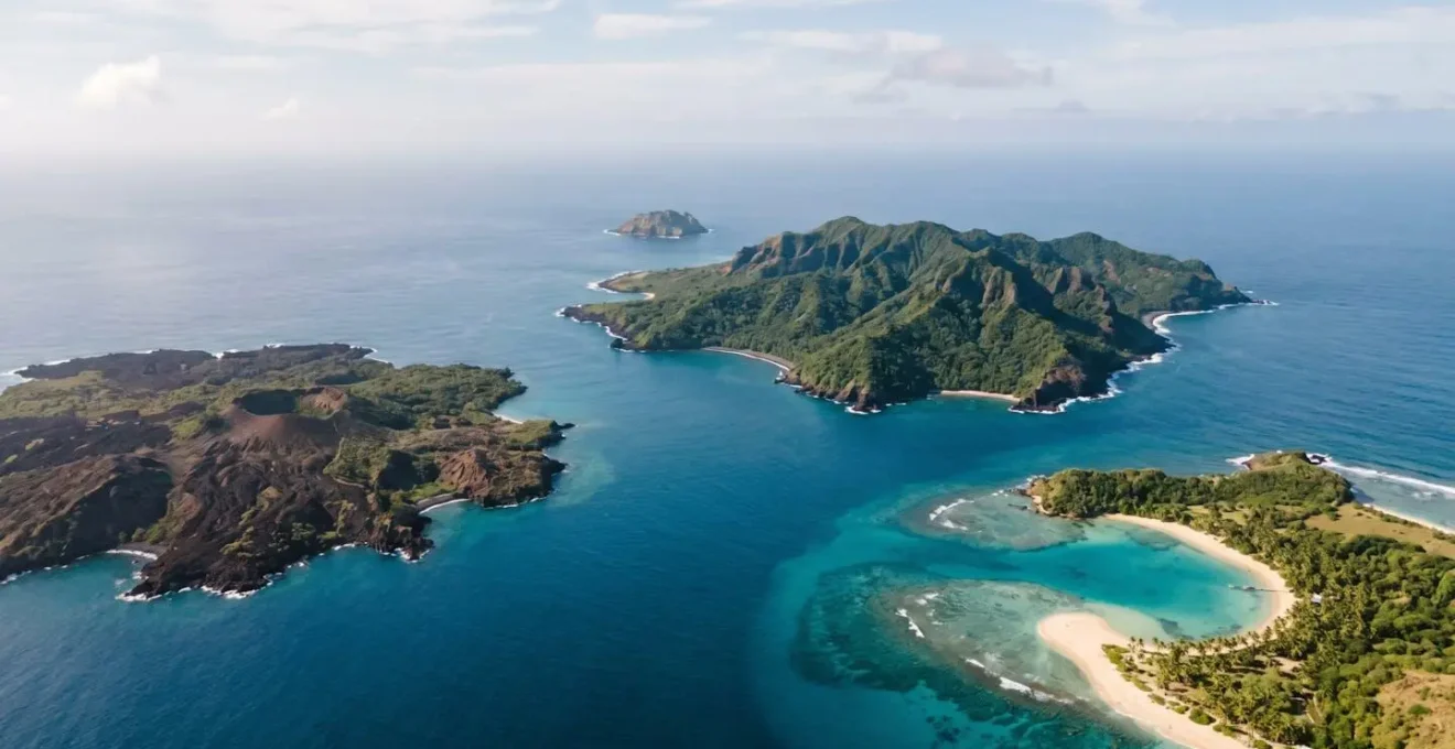 Aerial view of diverse tropical archipelago with contrasting island topographies under natural light