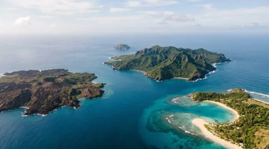 Aerial view of diverse tropical archipelago with contrasting island topographies under natural light