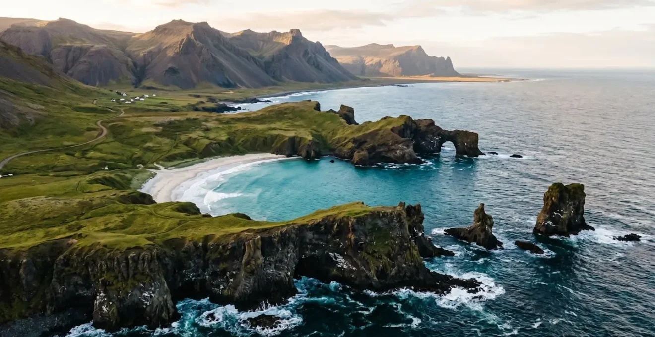 A dramatic wide-angle view showcasing multiple distinct coastal landscape types compressed into a single island vista, emphasizing geological diversity and scenic variety.