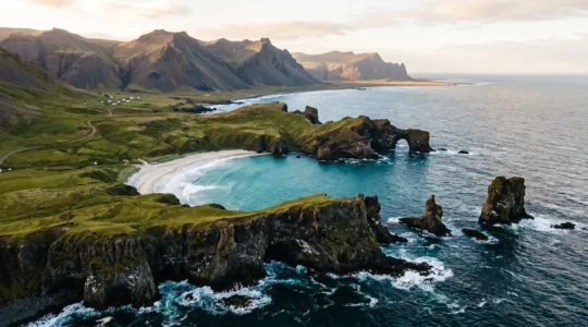 A dramatic wide-angle view showcasing multiple distinct coastal landscape types compressed into a single island vista, emphasizing geological diversity and scenic variety.